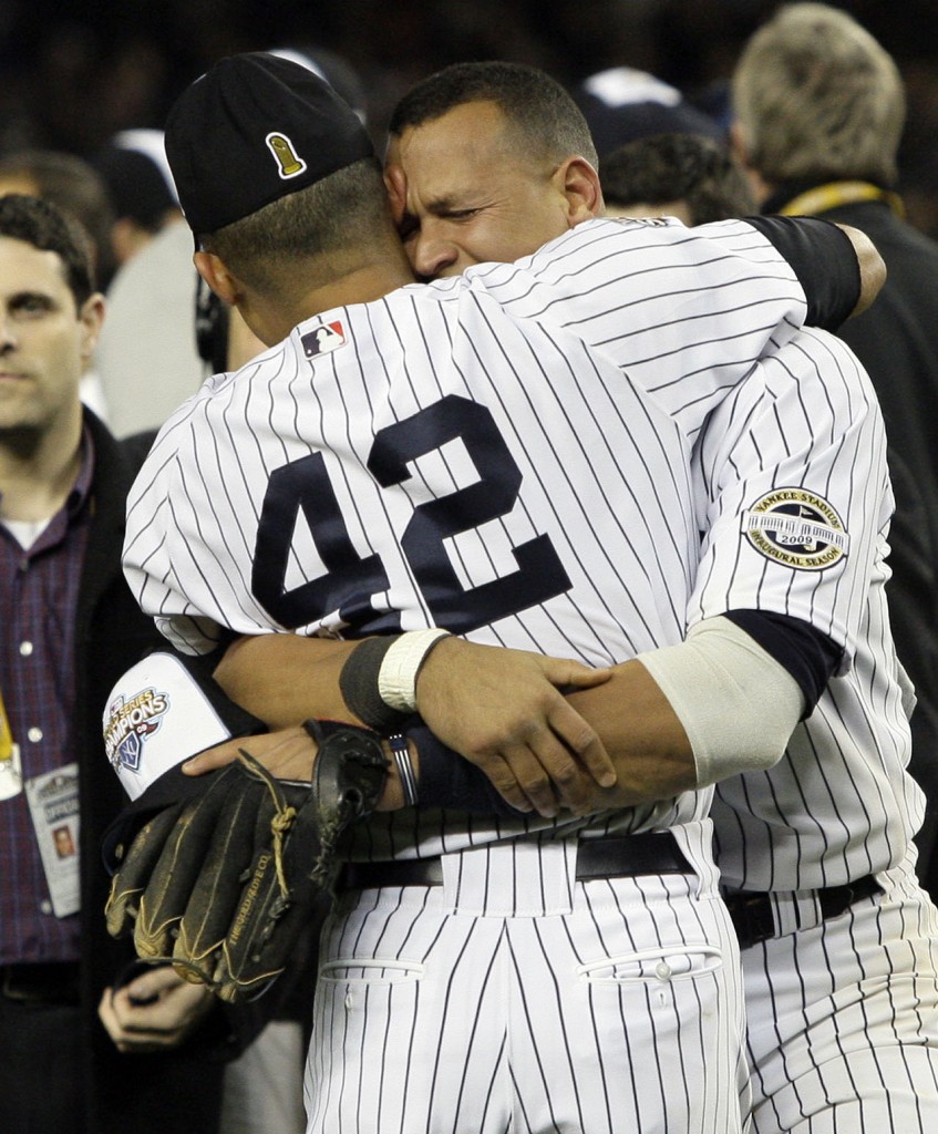 New York Yankees' Mariano Rivera (42) and Alex Rodriguez celebrate after the ninth inning of Game 6 of the Major League Baseball World Series against the Philadelphia Phillies Wednesday, Nov. 4, 2009, in New York. The Yankees won 7-3. (AP Photo/Elise Amendola)