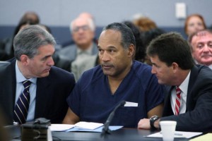 LAS VEGAS - DECEMBER 5:  O.J. Simpson (C) appears in court with attorneys Gabriel Grasso (L) and Yale Galanter prior to sentencing at the Clark County Regional Justice Center December 5, 2008 in Las Vegas, Nevada.  Simpson and co-defendant Clarence "C.J." Stewart were sentenced on 12 charges, including felony kidnapping, armed robbery and conspiracy related to a 2007 confrontation with sports memorabilia dealers in a Las Vegas hotel. (Photo by Issac Brekken-Pool/Getty Images)