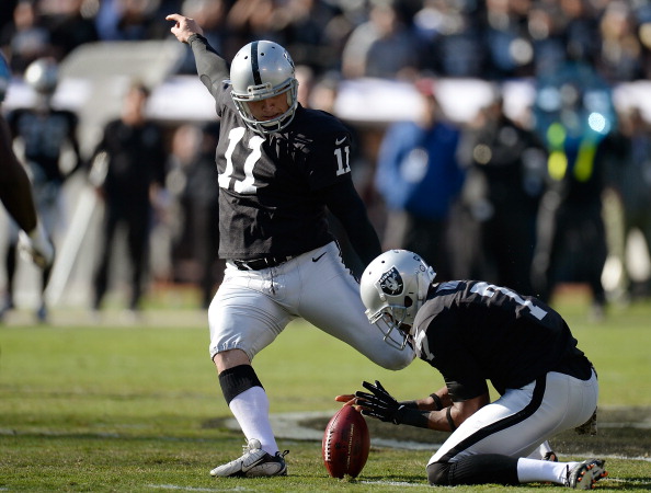 OAKLAND, CA - NOVEMBER 24:  Sebastian Janikowski #11 of the Oakland Raiders kicks a fifty-two yard field goal against the Tennessee Titans during the first quarter at O.co Coliseum on November 24, 2013 in Oakland, California.  (Photo by Thearon W. Henderson/Getty Images)