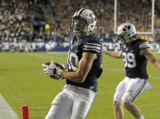 PROVO, UT - OCTOBER 2: Mitch Mathews #10 of the Brigham Young Cougars scores his 2nd fourth quarter touchdown as the Cougars beat the Connecticut Huskies 30-13 at LaVell Edwards Stadium on October 2, 2015 in Provo Utah. (Photo by Gene Sweeney Jr/Getty Images)