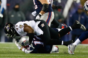 FOXBORO, MA - JANUARY 10:  Timmy Jernigan #97 of the Baltimore Ravens hits  Tom Brady #12 of the New England Patriots in the first half during the 2014 AFC Divisional Playoffs game at Gillette Stadium on January 10, 2015 in Foxboro, Massachusetts.  (Photo by Jared Wickerham/Getty Images)