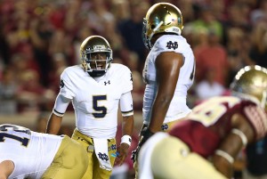 TALLAHASSEE, FL - OCTOBER 18:  Everett Golson #5 of the Notre Dame Fighting Irish yells to his teammates against the Florida State Seminoles during their game at Doak Campbell Stadium on October 18, 2014 in Tallahassee, Florida.  (Photo by Streeter Lecka/Getty Images)