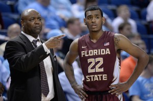 GREENSBORO, NC - MARCH 11:  Head coach Leonard Hamiton talks with Xavier Rathan-Mayes #22 of the Florida State Seminoles against the Clemson Tigers during a second round game of the ACC basketball tournament at Greensboro Coliseum on March 11, 2015 in Greensboro, North Carolina.  (Photo by Grant Halverson/Getty Images)