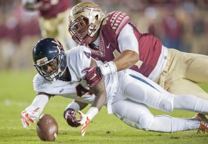 TALLAHASSEE, FL - NOVEMBER 8: Taquan Mizzell #4 of the Virginia Cavaliers and DeMarcus Walker #44 of the Florida State Seminoles go after a fumbled ball during the first half at Doak Campbell Stadium on November 8, 2014 in Tallahassee, Florida. (Photo by Jeff Gammons/Getty Images)
