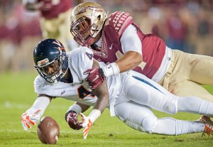 TALLAHASSEE, FL - NOVEMBER 8: Taquan Mizzell #4 of the Virginia Cavaliers and DeMarcus Walker #44 of the Florida State Seminoles go after a fumbled ball during the first half at Doak Campbell Stadium on November 8, 2014 in Tallahassee, Florida. (Photo by Jeff Gammons/Getty Images)