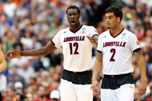 SYRACUSE, NY - MARCH 29:  Mangok Mathiang #12 of the Louisville Cardinals reacts with teammate Quentin Snider #2 in the first half of the game ams during the East Regional Final of the 2015 NCAA Men's Basketball Tournament at Carrier Dome on March 29, 2015 in Syracuse, New York.  (Photo by Maddie Meyer/Getty Images)