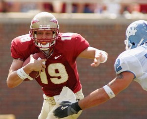 TALLAHASSEE, FL - OCTOBER 2:  Quarterback Wyatt Sexton, #19 of the Florida State Seminoles fights off the tackle of defender Jeff Longhany #52 of North Carolina Tarheels at Doak Campbell Stadium on October 2, 2004 in Tallahassee, Florida. (Photo by Scott Halleran/Getty Images)