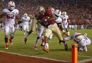 TALLAHASSEE, FL - NOVEMBER 02:  Devonta Freeman #8 of the Florida State Seminoles scores a touchdown during a game against the Miami Hurricanes at Doak Campbell Stadium on November 2, 2013 in Tallahassee, Florida.  (Photo by Mike Ehrmann/Getty Images)
