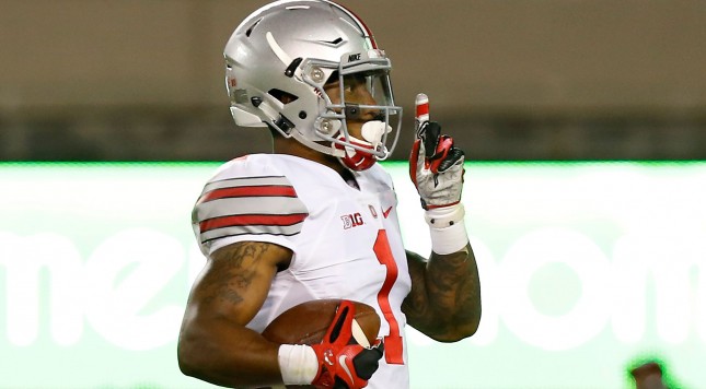 Sep 7, 2015; Blacksburg, VA, USA; Ohio State Buckeyes wide receiver Braxton Miller (1) gestures to the crowd while running with the ball enroute to scoring a touchdown against the Virginia Tech Hokies in the third quarter at Lane Stadium. Mandatory Credit: Geoff Burke-USA TODAY Sports